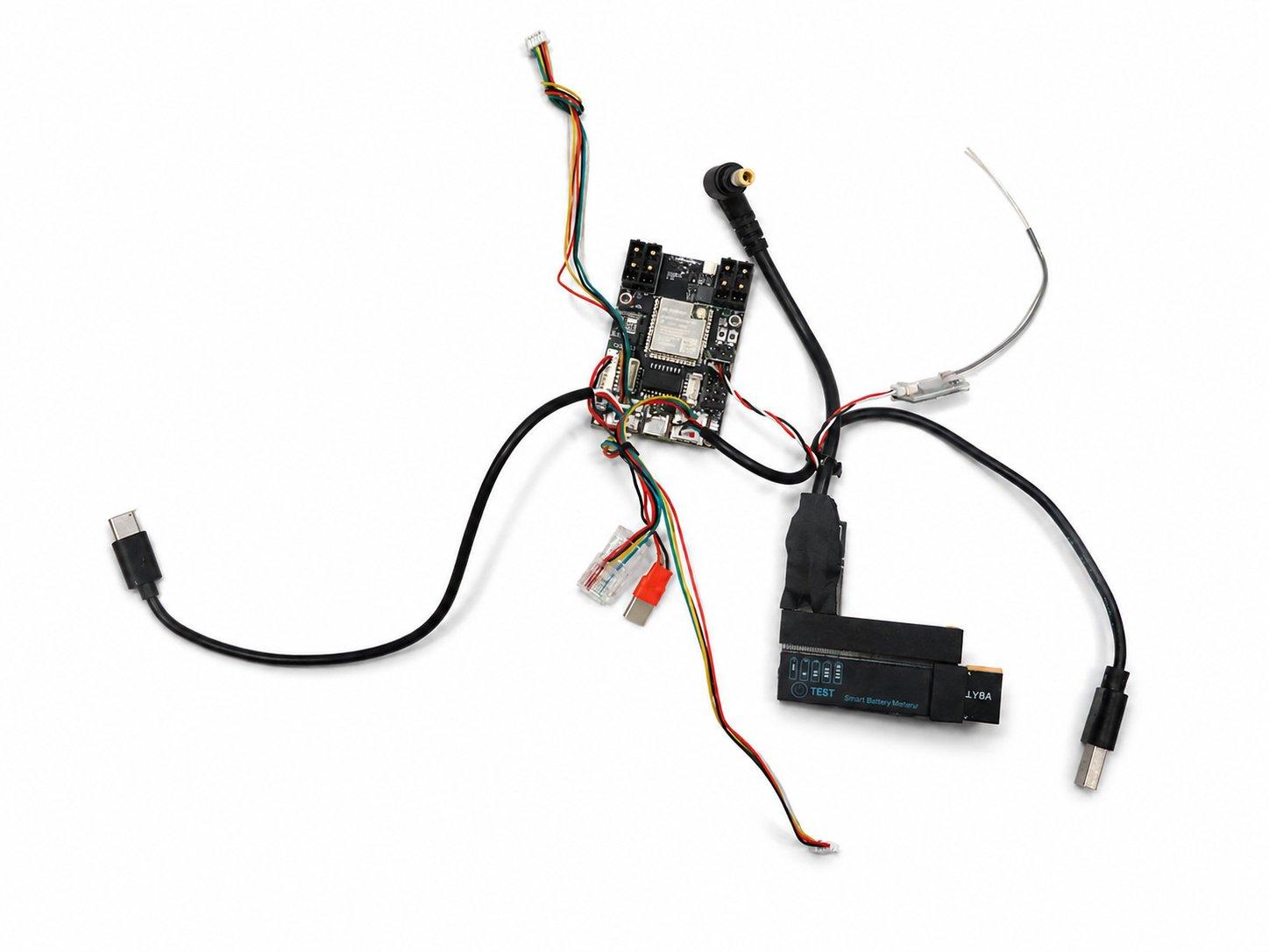 The OSCORE ESP32-S3 control board with its wiring harness