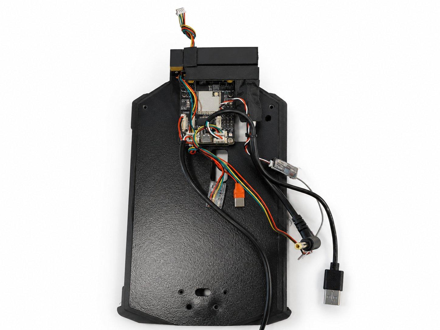 The OSCORE board's harness routed along the underside of the mid section