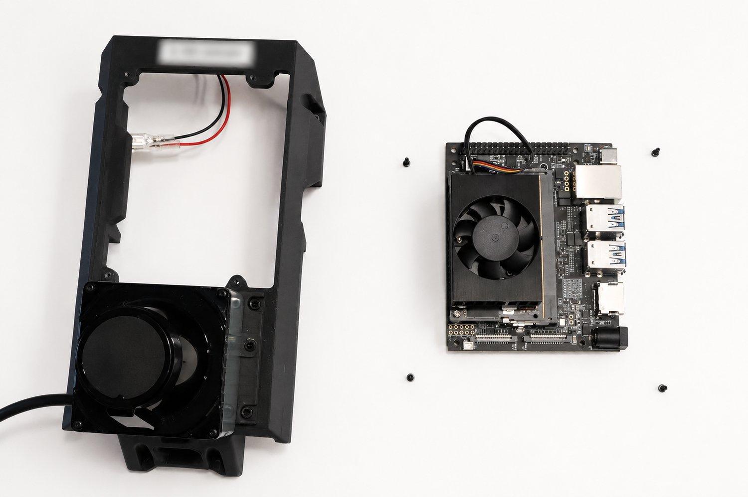 The top plate with the LiDAR set, beside the Jetson Orin Nano and its four screws