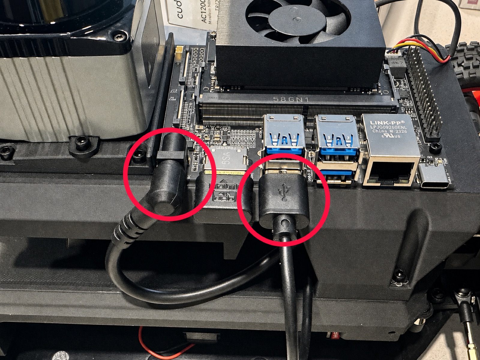 Click to enlarge The USB-A and DC barrel jack cables plugged into the Jetson