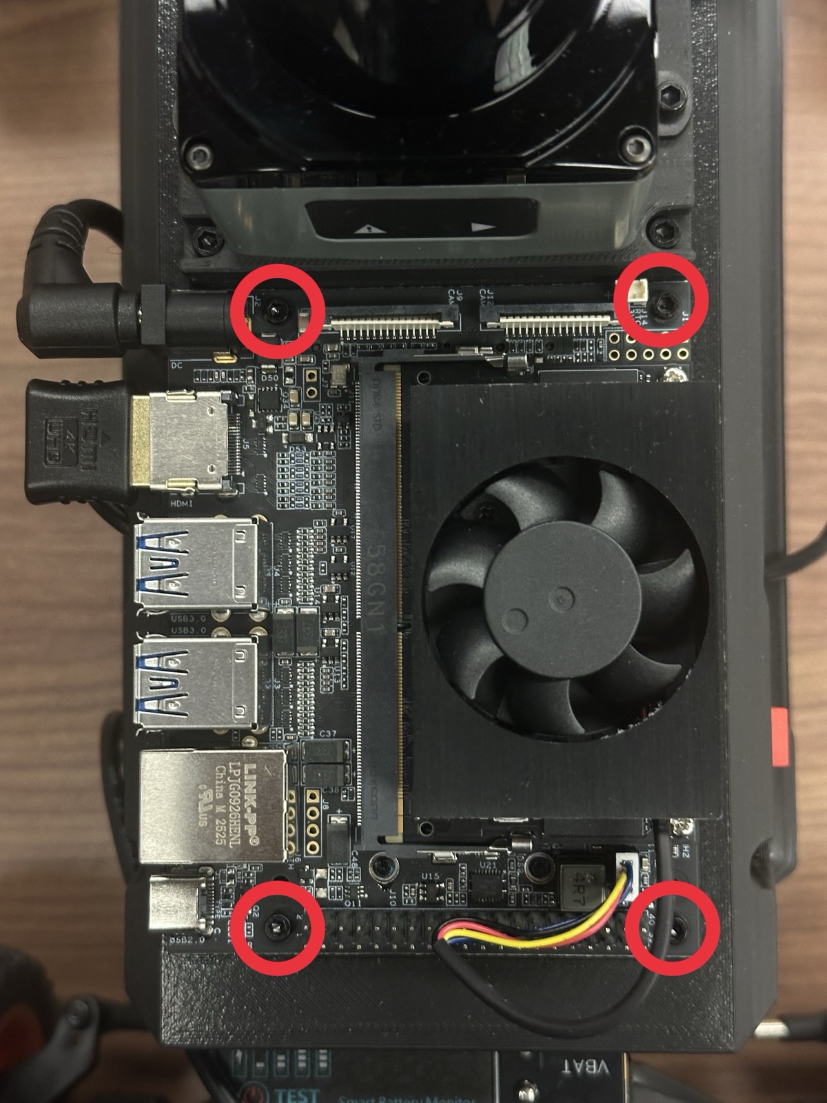 Click to enlarge The four hex screws holding the Jetson to its chassis mount