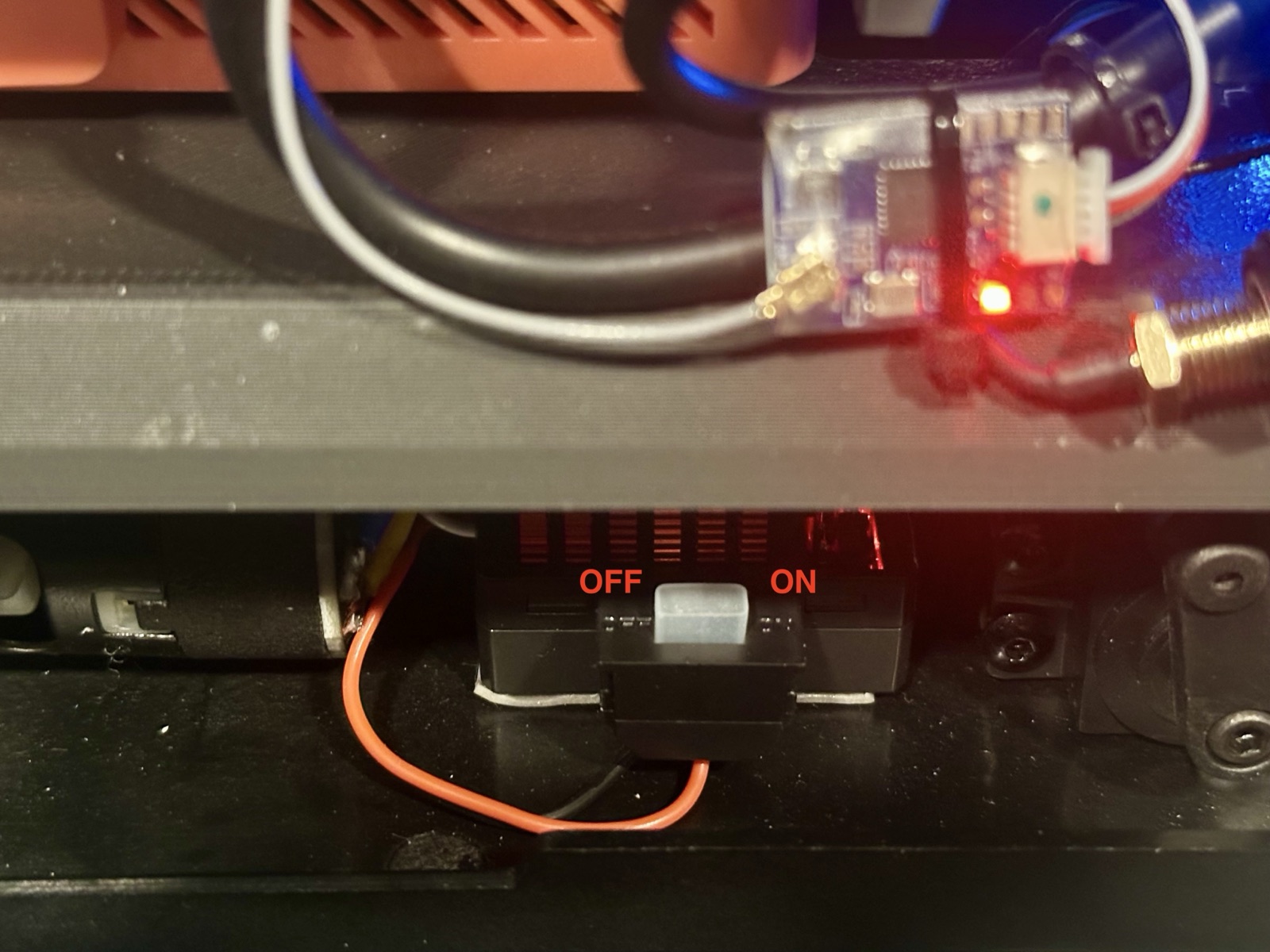 The ESC switch inside the chassis, with the OFF and ON positions labelled