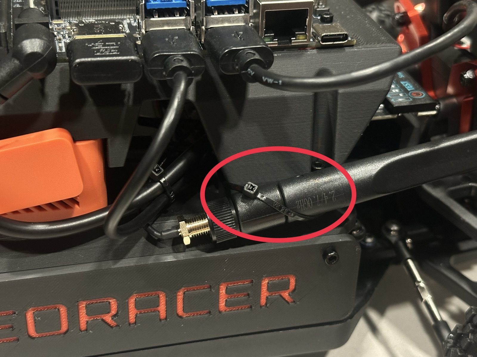 Click to enlarge The right antenna zip-tied to the front of the top chassis
