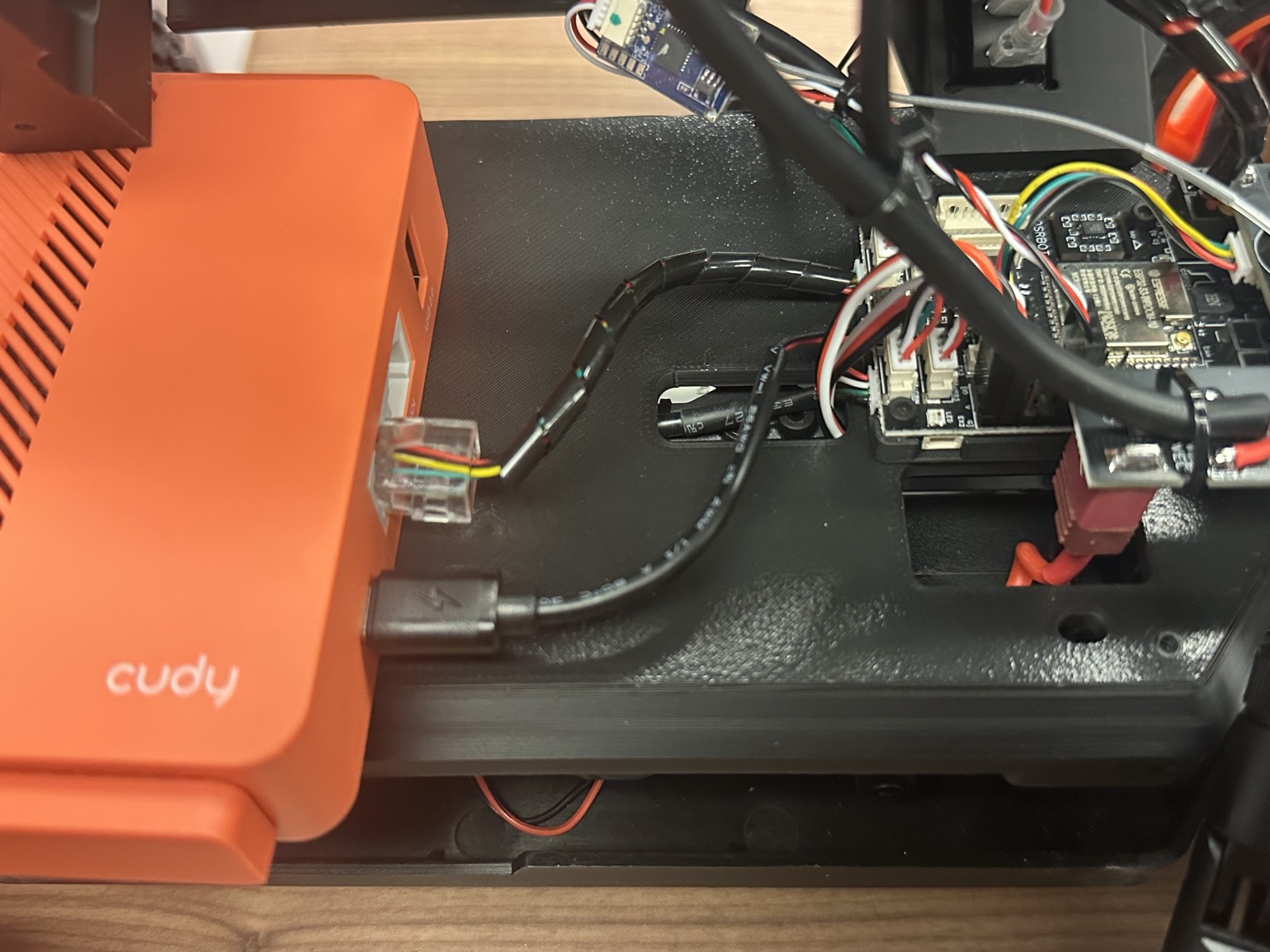 Click to enlarge The Cudy router in the chassis with the Ethernet and short USB-C cable connected